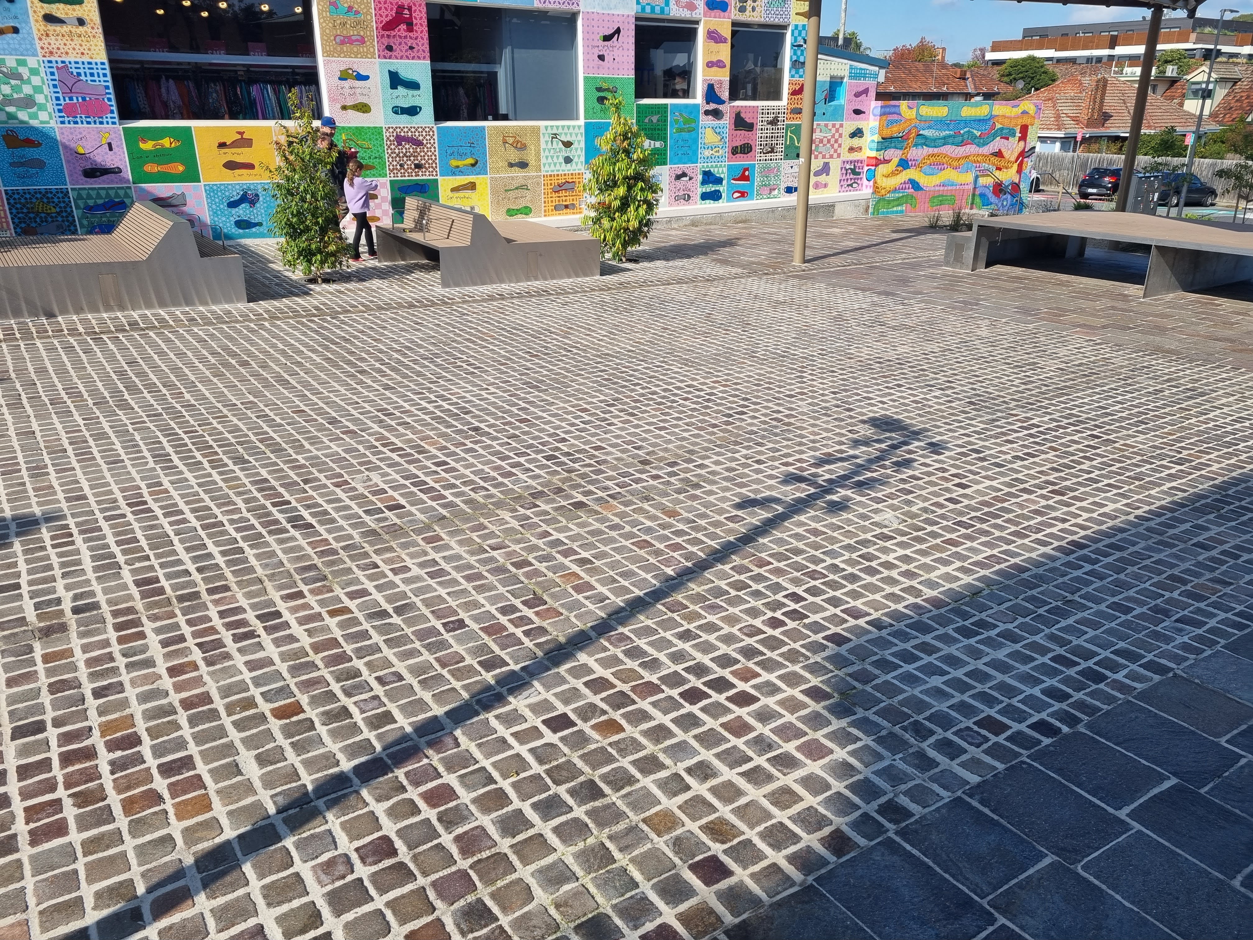 Porphyry paving showing natural split surfaces and colour variation